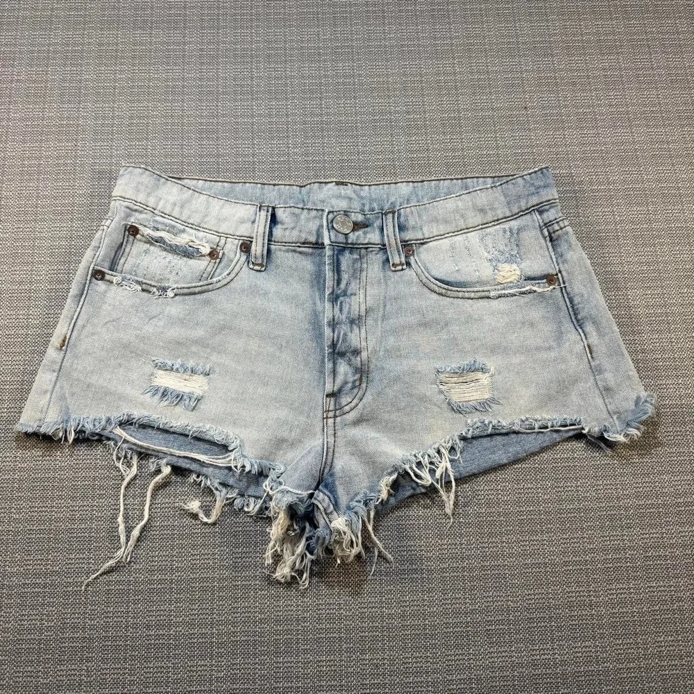 BDG Distressed blue denim shorts with frayed hem
